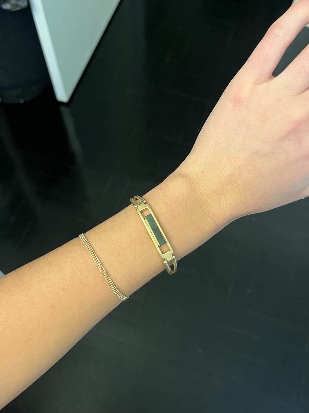 Gold delicate bangle with green stone